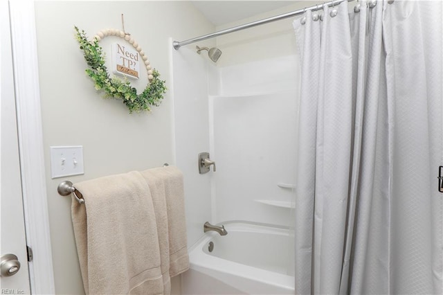 bathroom featuring shower / bath combination with curtain