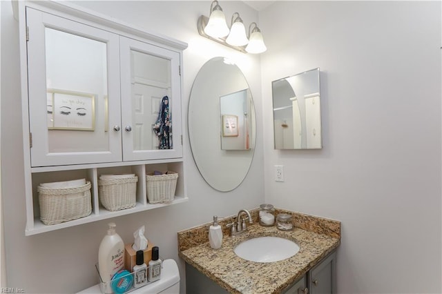 bathroom featuring toilet and vanity