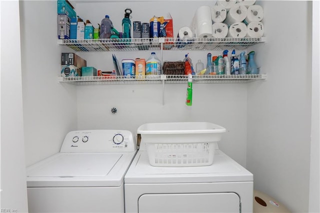 laundry area featuring laundry area and washer and clothes dryer