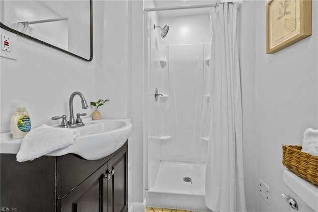 bathroom featuring vanity and a stall shower