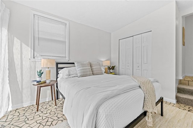 bedroom featuring a closet and baseboards