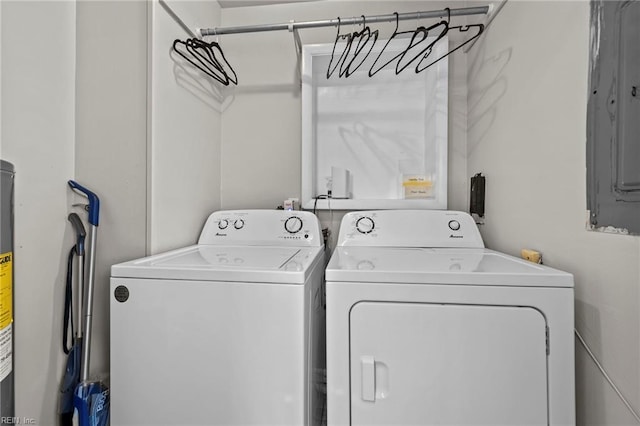 washroom with independent washer and dryer and laundry area