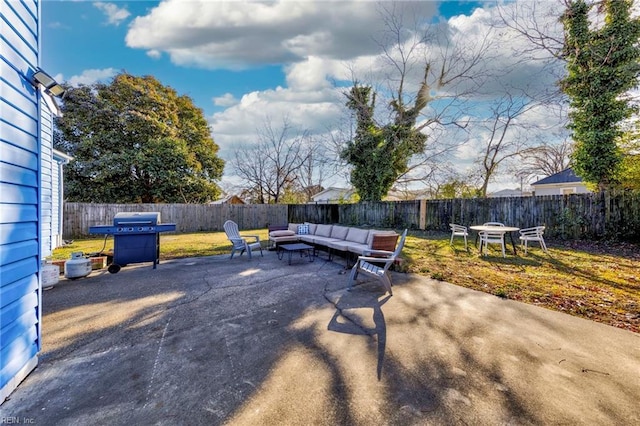 view of patio / terrace with outdoor lounge area, a fenced backyard, and a grill