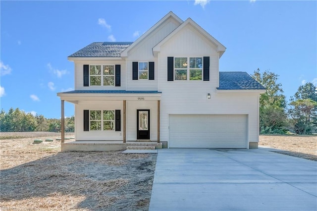 view of front of property featuring a porch, concrete driveway, an attached garage, and a shingled roof