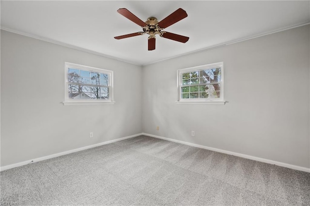 spare room with baseboards, carpet, and ceiling fan