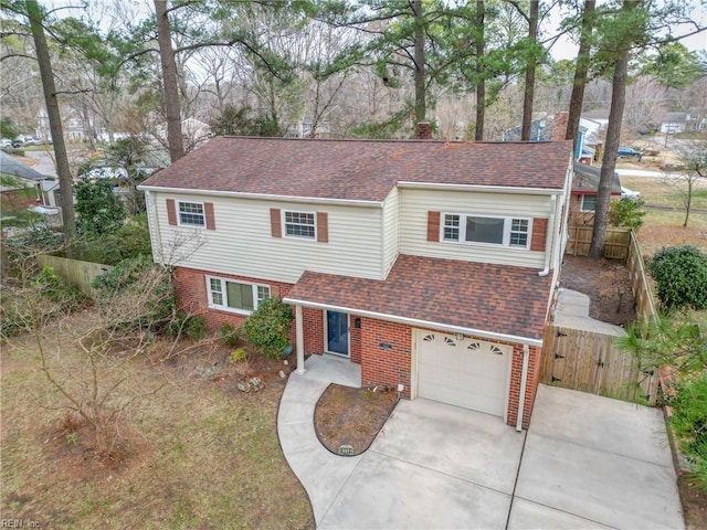 view of front of property with a gate, fence, driveway, a shingled roof, and brick siding