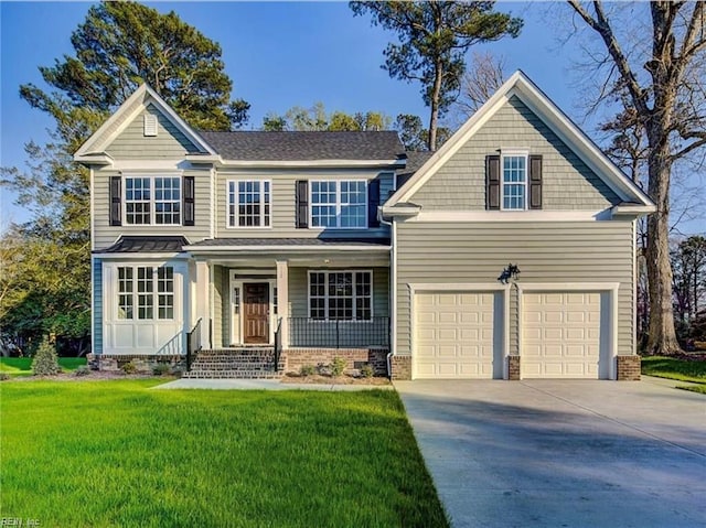 view of front of home with covered porch, driveway, a front lawn, and a garage