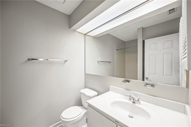 full bathroom with vanity, toilet, baseboards, and visible vents