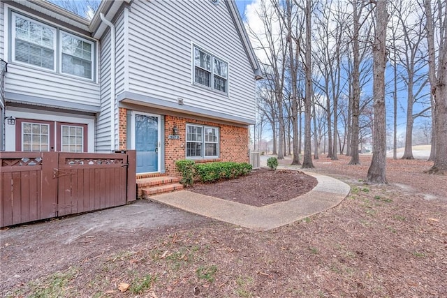 exterior space with brick siding