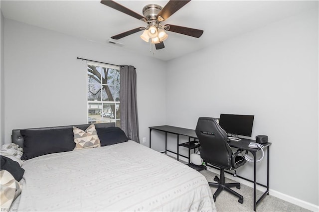 bedroom featuring visible vents, baseboards, carpet, and a ceiling fan