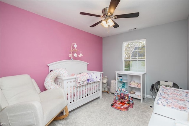 bedroom with visible vents, baseboards, a ceiling fan, and carpet floors