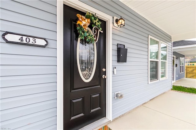 entrance to property featuring a porch