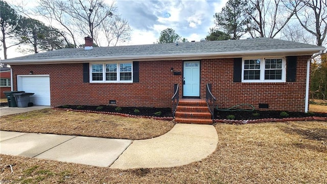 single story home with crawl space, a garage, and brick siding