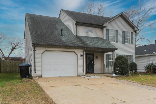 traditional home featuring a garage, fence, concrete driveway, and a shingled roof