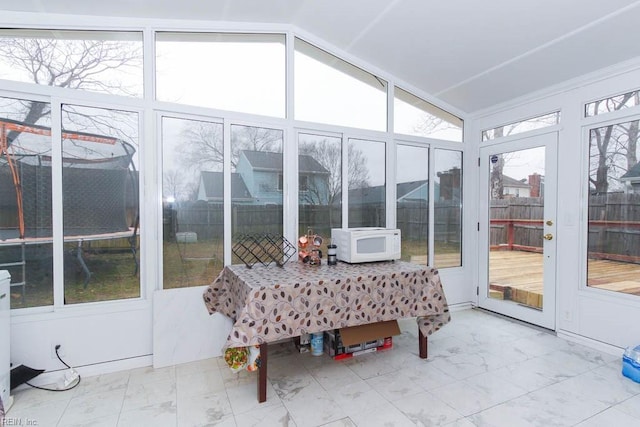 sunroom / solarium with lofted ceiling