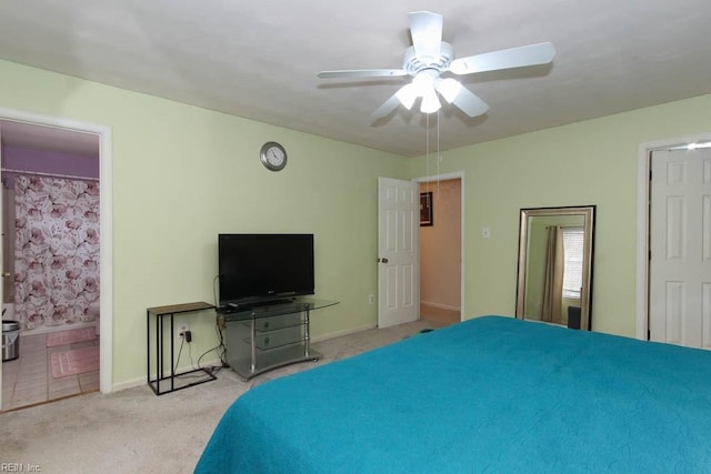 carpeted bedroom with baseboards and a ceiling fan