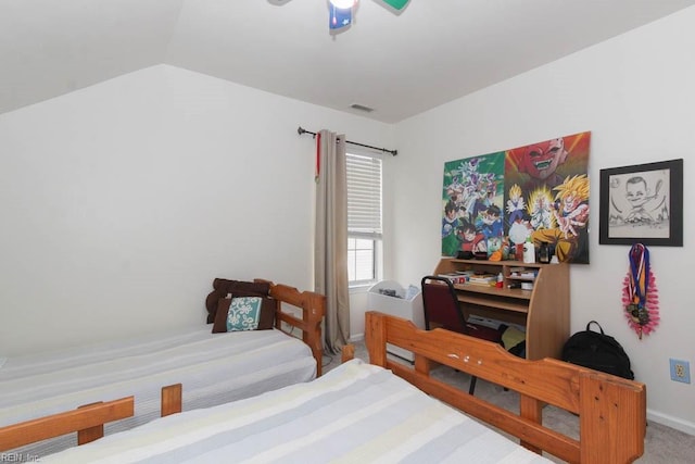 bedroom with lofted ceiling and visible vents