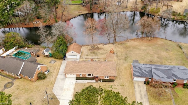 birds eye view of property with a water view