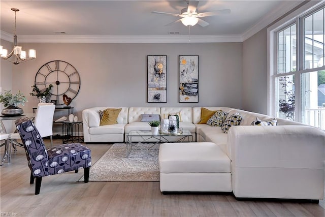 5311 Salzman St, Williamsburg, VA 23188 - living area featuring wood finished floors, a chandelier, a ceiling fan, and ornamental molding