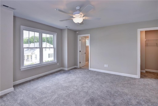 5311 Salzman St, Williamsburg, VA 23188 - unfurnished bedroom featuring a spacious closet, carpet flooring, and baseboards