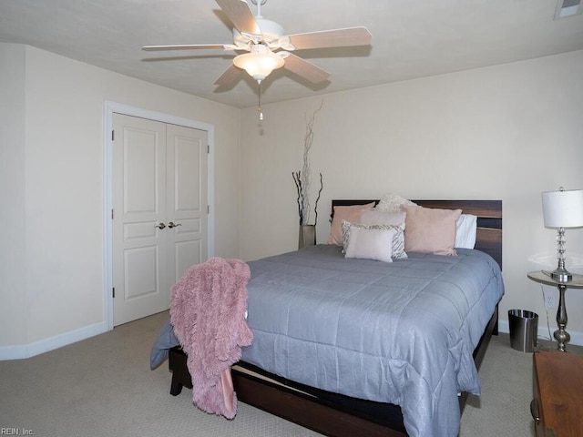 carpeted bedroom featuring visible vents, baseboards, and ceiling fan