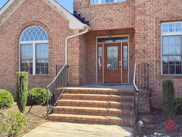 entrance to property with brick siding