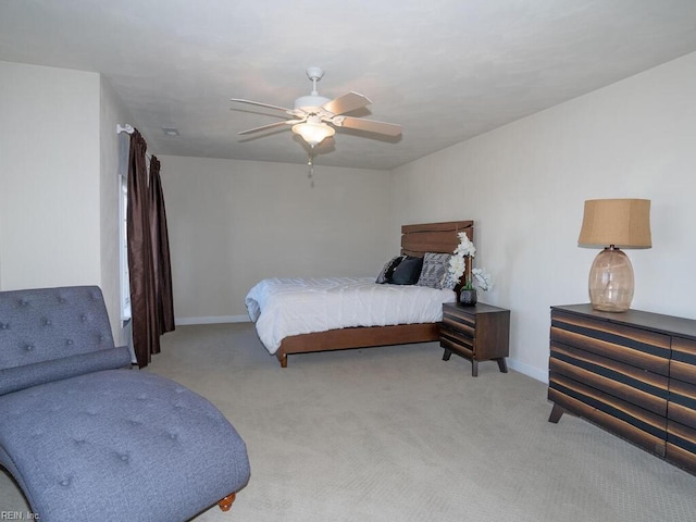 bedroom featuring baseboards, carpet floors, and a ceiling fan