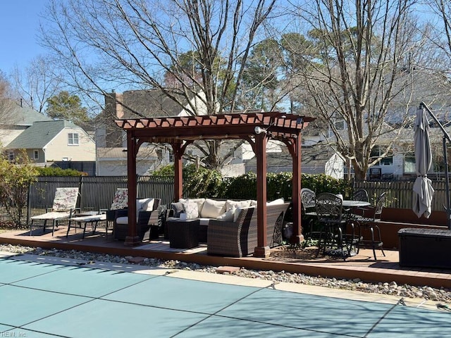 view of swimming pool with a pergola, an outdoor hangout area, a wooden deck, and fence