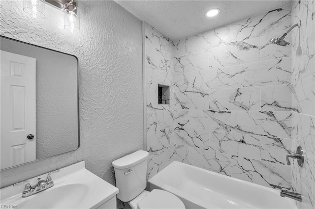 full bath featuring tub / shower combination, toilet, vanity, a textured wall, and a textured ceiling