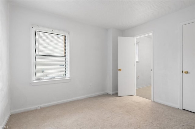 2118 Madison Ave, Newport News, VA 23607 - unfurnished bedroom with baseboards and carpet flooring
