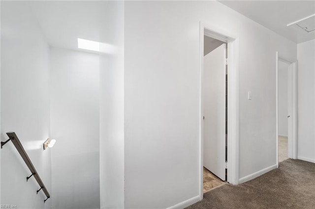 2118 Madison Ave, Newport News, VA 23607 - hallway with baseboards, carpet flooring, and an upstairs landing