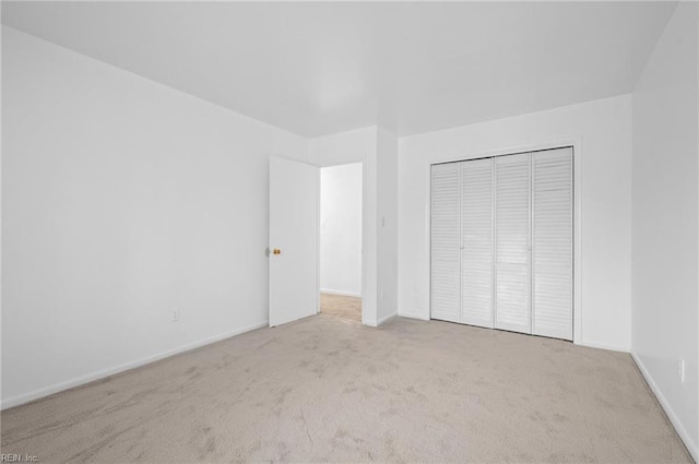 2118 Madison Ave, Newport News, VA 23607 - unfurnished bedroom with baseboards, a closet, and carpet flooring