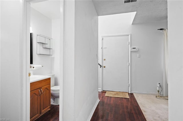 2118 Madison Ave, Newport News, VA 23607 - bathroom with visible vents, baseboards, toilet, wood finished floors, and vanity