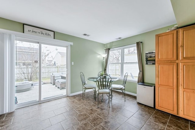 dining area with visible vents and baseboards