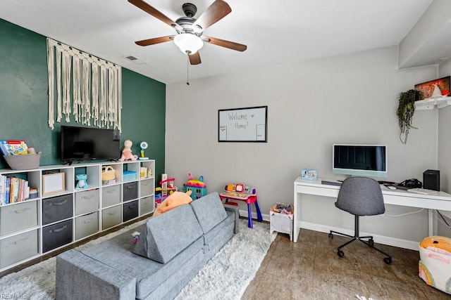 home office featuring visible vents, baseboards, and a ceiling fan