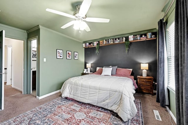 carpeted bedroom featuring visible vents, ceiling fan, crown molding, and baseboards