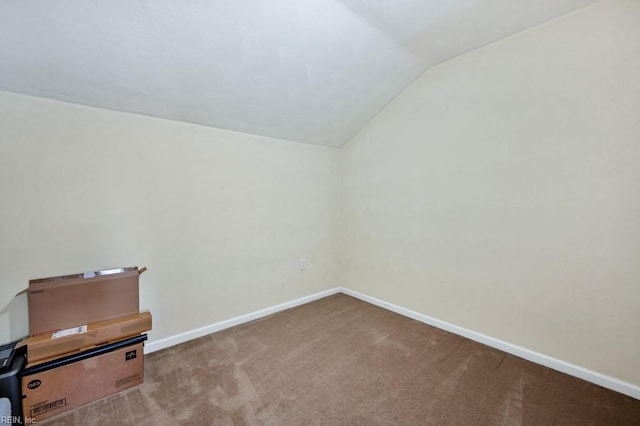 bonus room featuring baseboards, carpet flooring, and vaulted ceiling