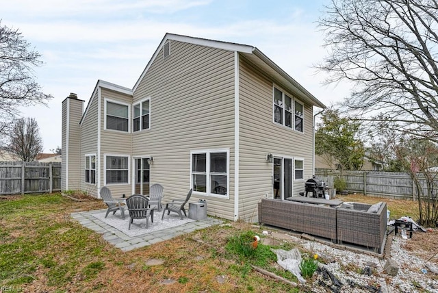 back of property featuring a patio area and a fenced backyard