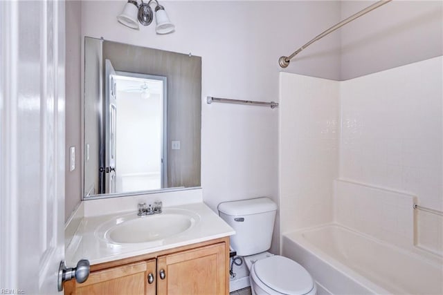 full bathroom featuring toilet, vanity, and bathing tub / shower combination