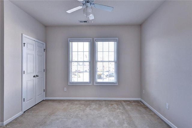 unfurnished bedroom featuring baseboards, visible vents, and carpet floors