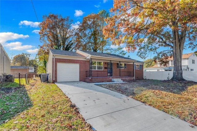 ranch-style home featuring brick siding, concrete driveway, a garage, and fence