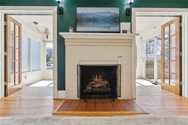 interior details with a fireplace and wood finished floors