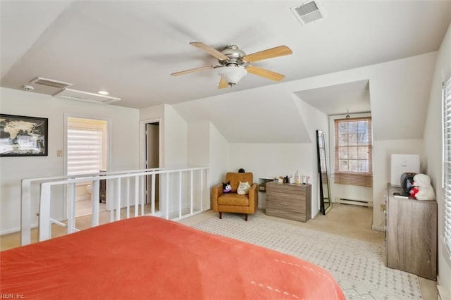 carpeted bedroom featuring vaulted ceiling, multiple windows, visible vents, and baseboard heating