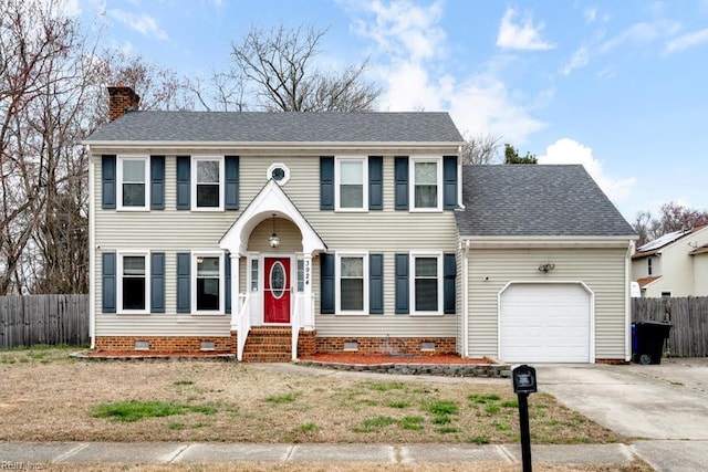 colonial home with a chimney, fence, a garage, and crawl space