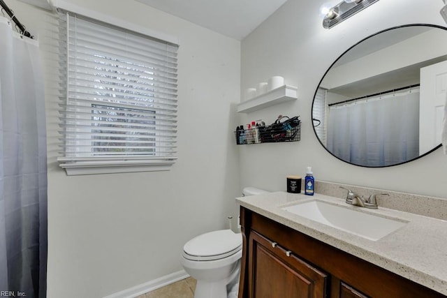 full bath with vanity, toilet, baseboards, and tile patterned flooring