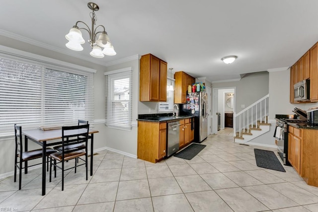 kitchen with light tile patterned floors, brown cabinetry, ornamental molding, stainless steel appliances, and a chandelier