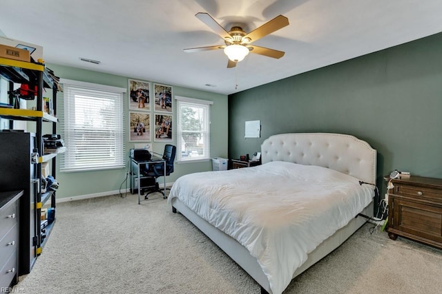 bedroom featuring visible vents, baseboards, carpet floors, and ceiling fan