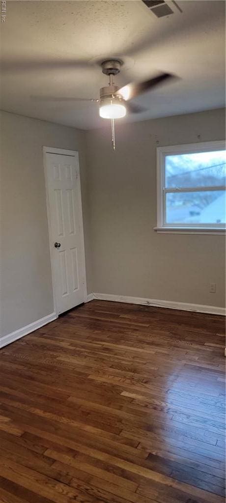 1832 Roanoke Ave, Newport News, VA 23607 - empty room featuring dark wood-style floors, visible vents, ceiling fan, and baseboards