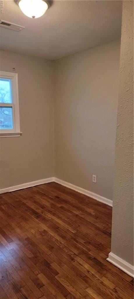 1832 Roanoke Ave, Newport News, VA 23607 - spare room with dark wood-style floors, visible vents, and baseboards