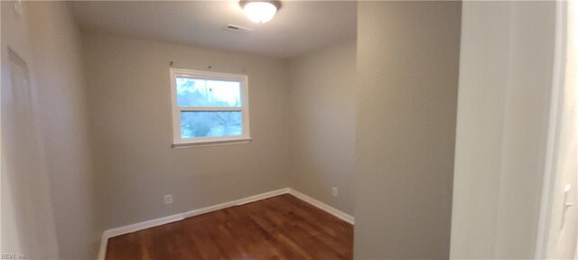 1832 Roanoke Ave, Newport News, VA 23607 - empty room featuring baseboards, visible vents, and dark wood-style flooring